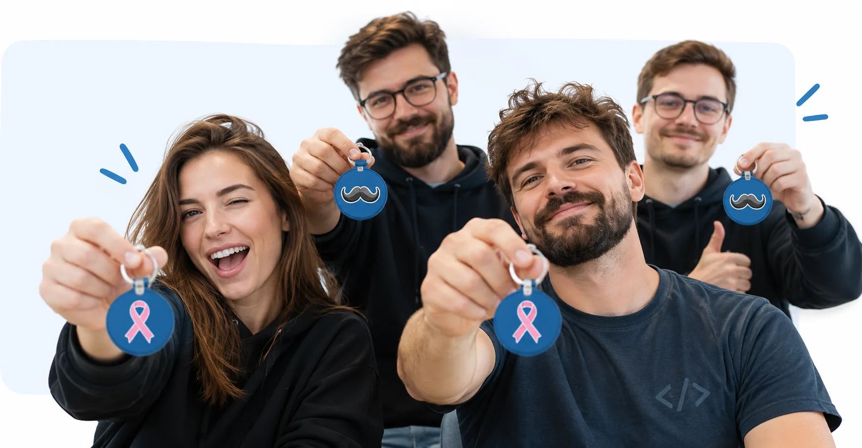 Pracownicy Edge One Solutions z brelokami kampanii profilaktycznej